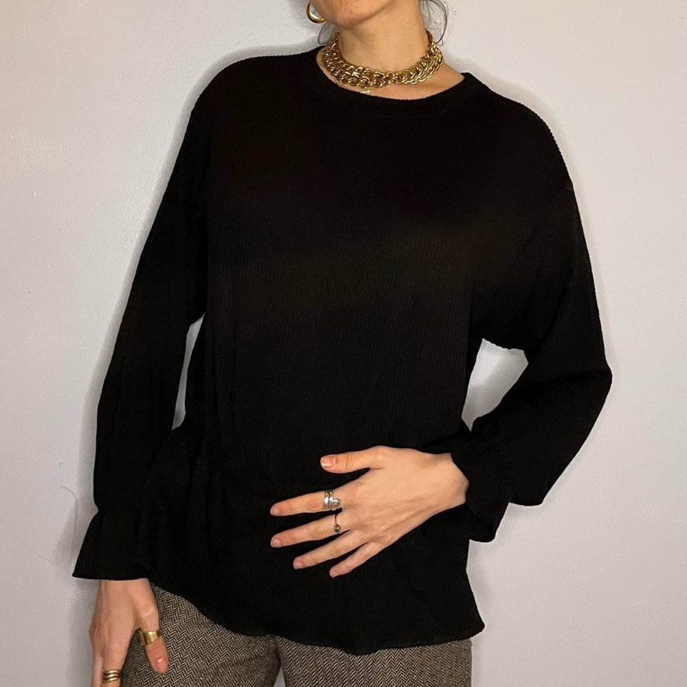 Black ribbed long sleeve top with elastic waist band and elastic cuffing